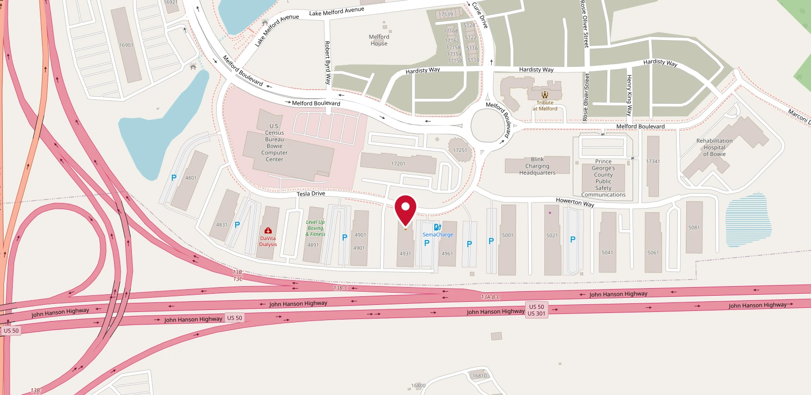 A street map of the Melford business park in Bowie, with a red pin on our building on Tesla Drive. The John Hanson Highway (US 50 / US 301) runs along the south side, and Melford Boulevard loops around the north.